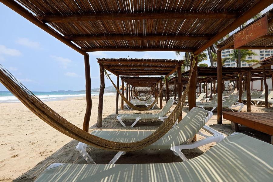 Emporio Ixtapa Hotel Ixtapa  Exterior photo Hammocks at a beach resort